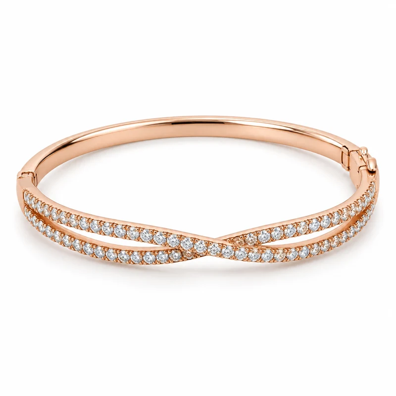 A complete rose-gold oval hinged bangle with two crossing diamond-pavé rows across its front, on pure white.