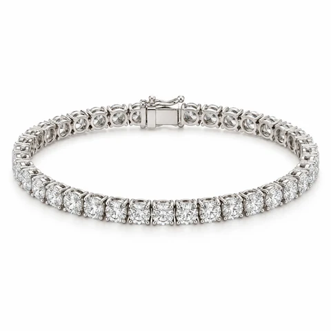 A complete white-gold diamond tennis bracelet on white.
